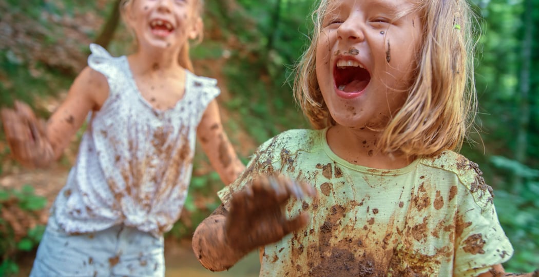 Girls playing in mud